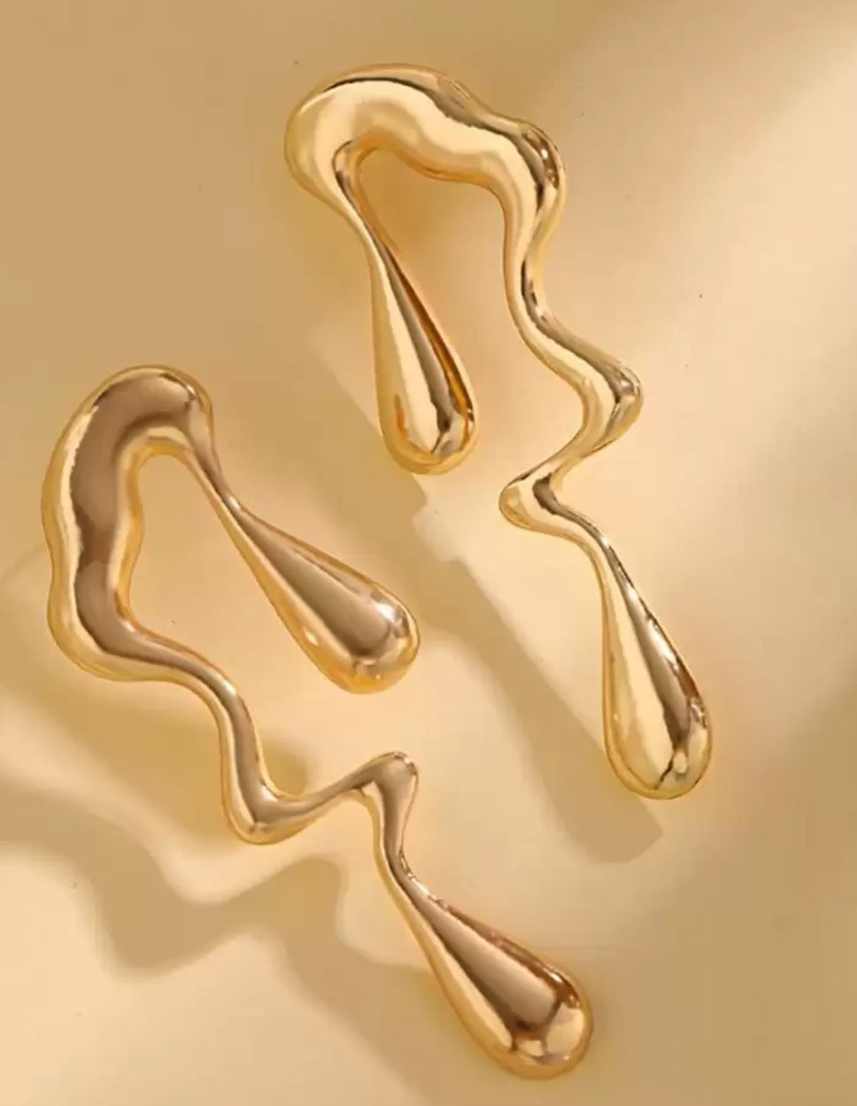 Stylish Golden Coloured Melting Design Earrings